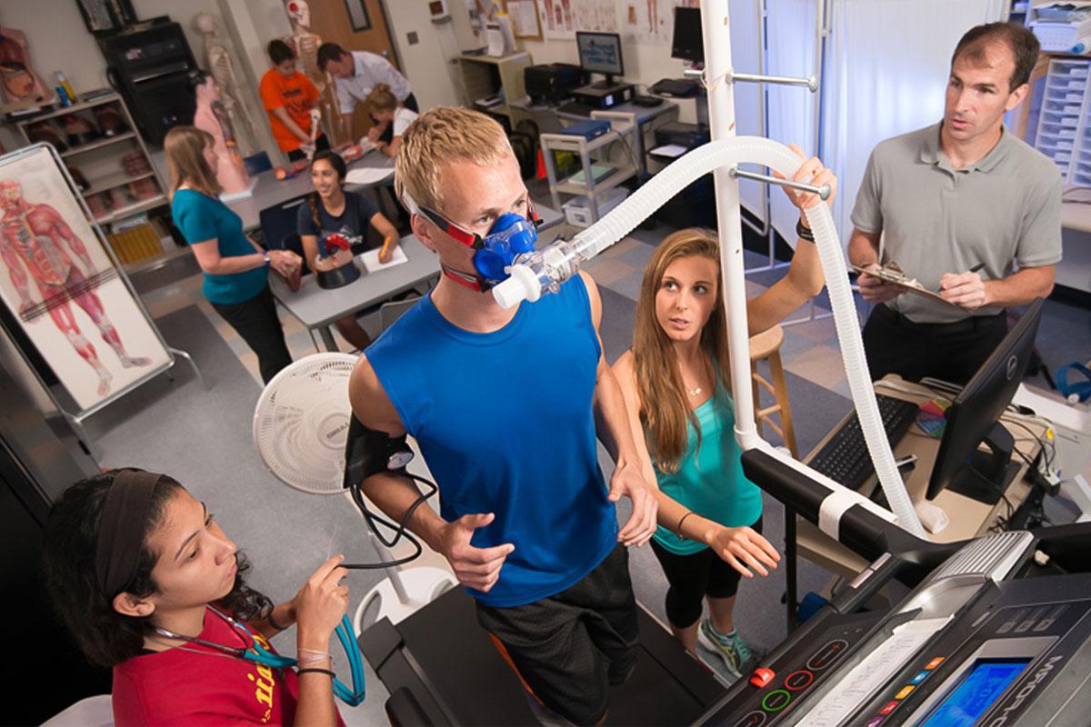 Students from the exercise science program gather data in a lab session.